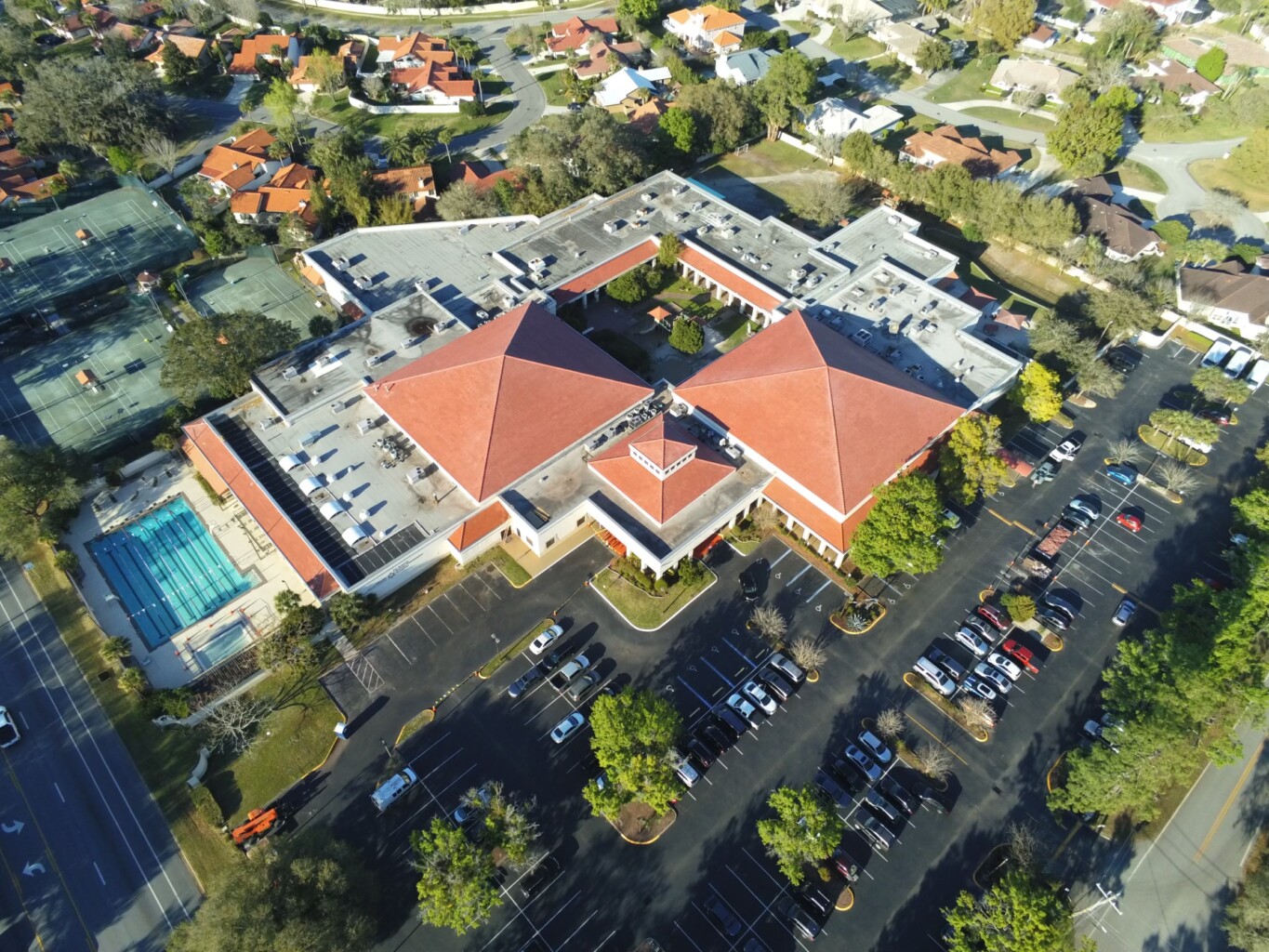 An aerial view of a building with a red roof.