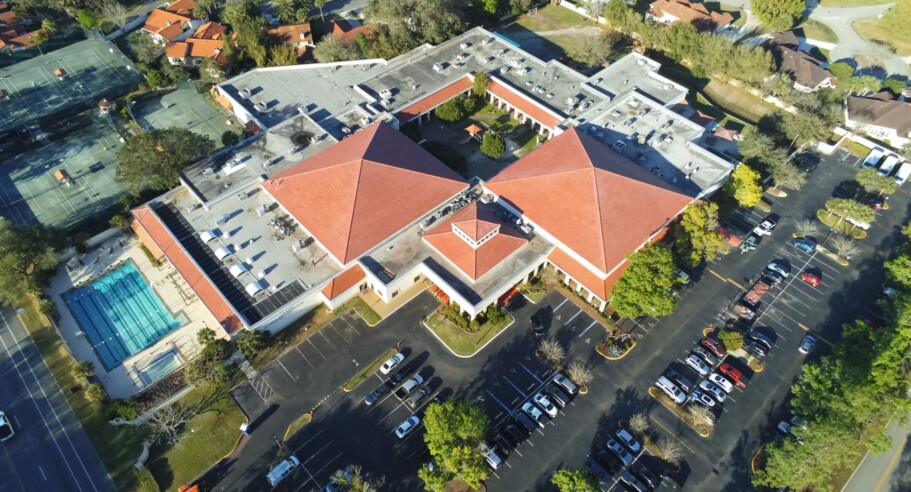 An aerial view of a building with a red roof.