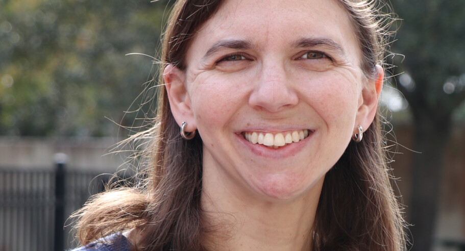 A woman wearing a blue shirt.