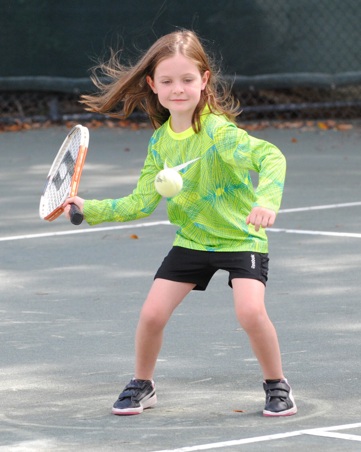 Girl playing tennis.
