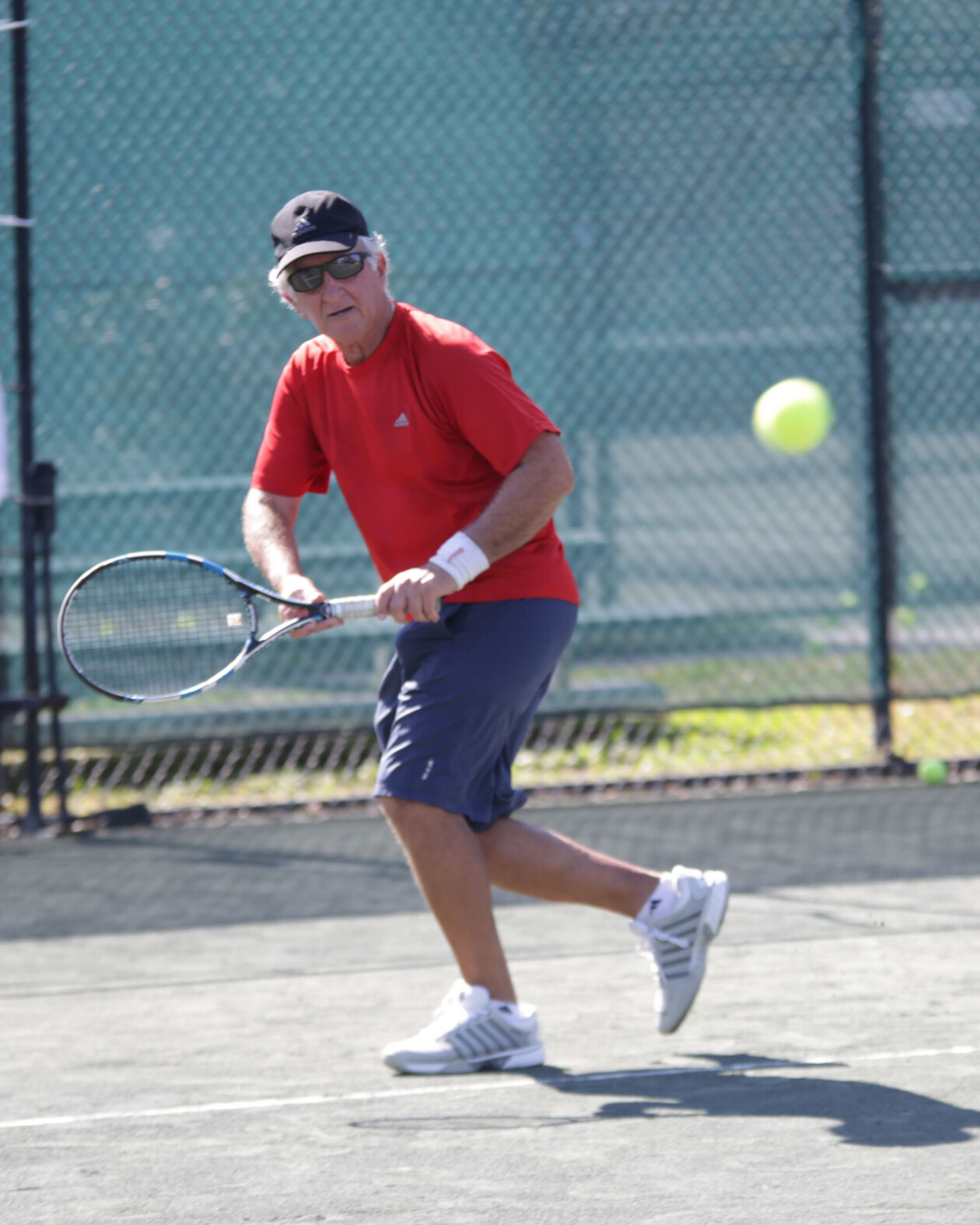 Man playing tennis.