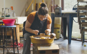 Woman doing pottery.