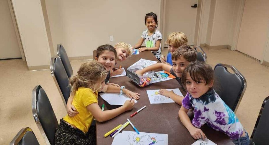 kids around table.