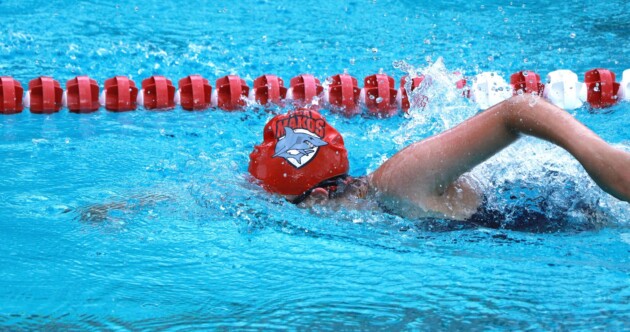 A woman swimming in a pool.