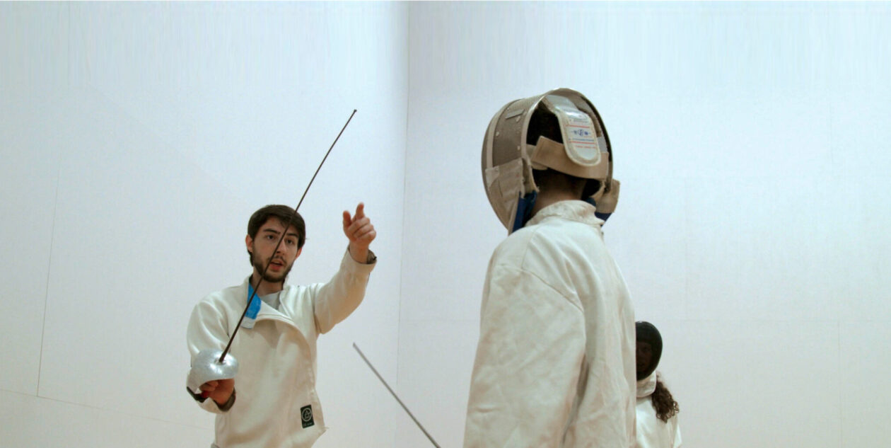 Two people fencing.