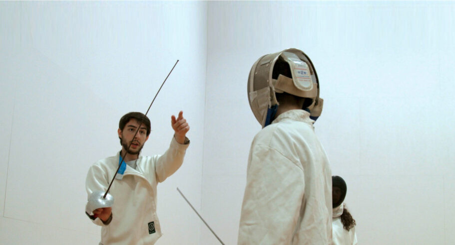 Two people fencing.