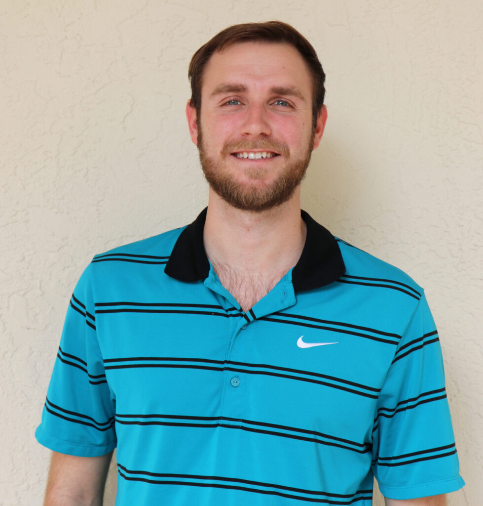 A man wearing a blue and black striped nike polo shirt.