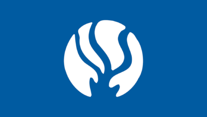 A blue and white logo with a leaf on it.