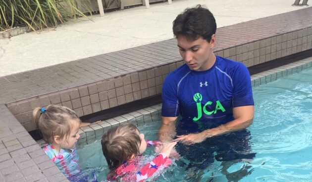 JCA Swim Instructor during Learn to Swim Lessons with young swimmers
