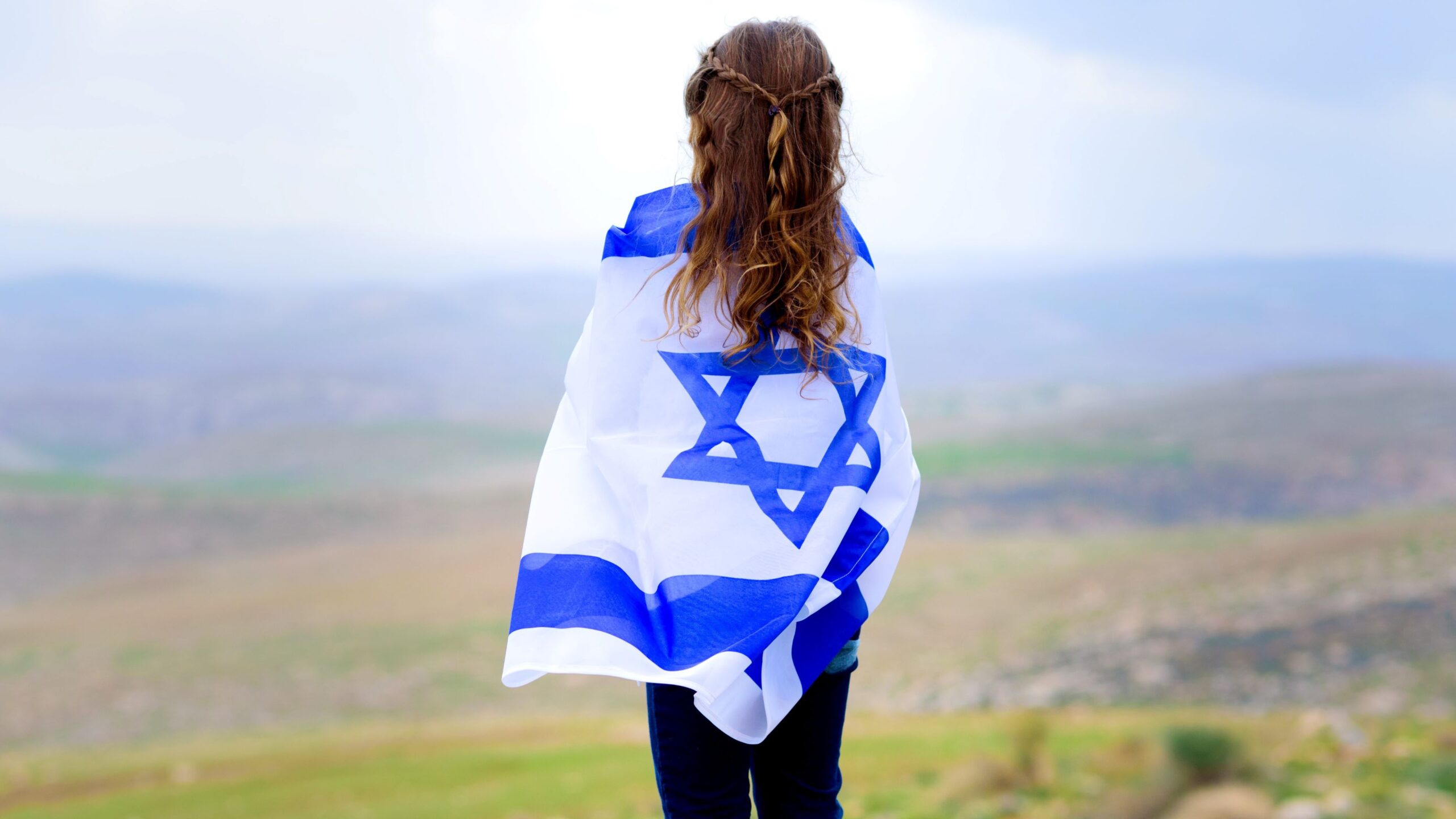 An israeli girl with an israeli flag.
