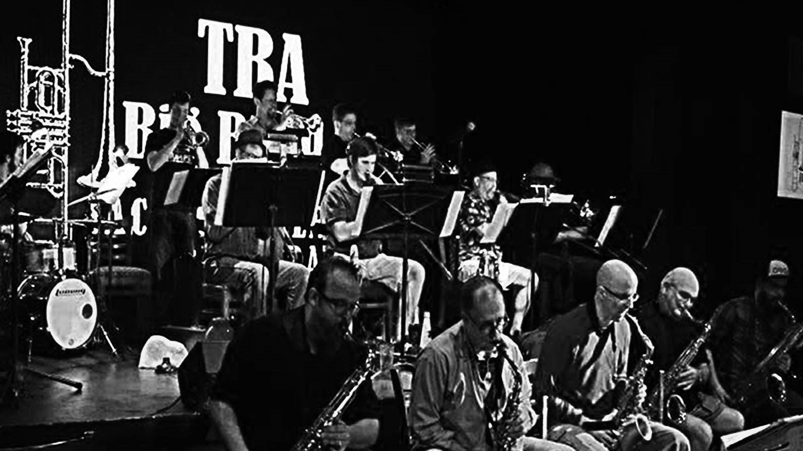 A black and white photo of a band with saxophones.