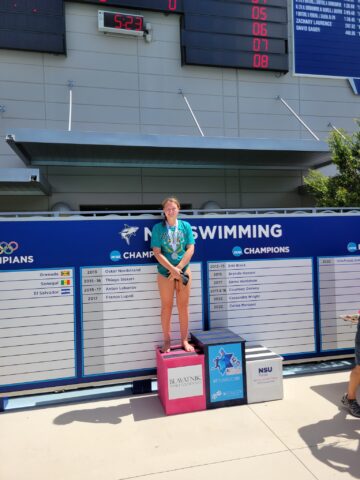 A woman standing on a podium.