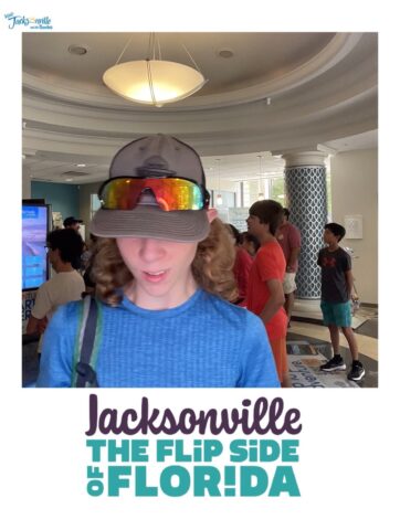 Person wearing a baseball cap and sunglasses indoors. Text reads "Jacksonville: The Flip Side of Florida." Several people are gathered in the background.