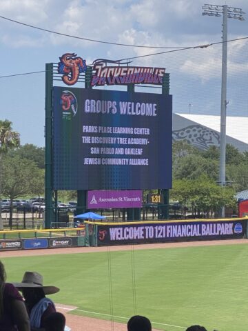 Scoreboard at 121 Financial Ballpark welcomes various groups, including Parks Place Learning Center and Jewish Community Alliance.