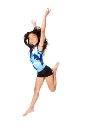 A young girl jumping in the air.