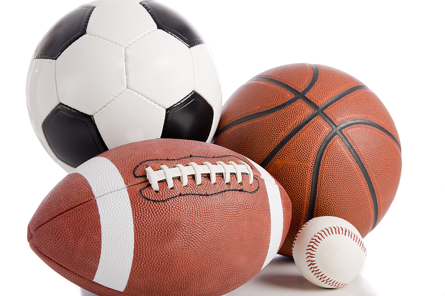 A group of sports balls on a white background.