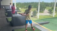 Teens golfing at Top Golf.