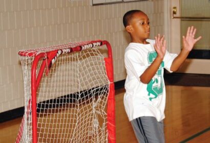Young boy in front of goal during Sports Extravaganza.