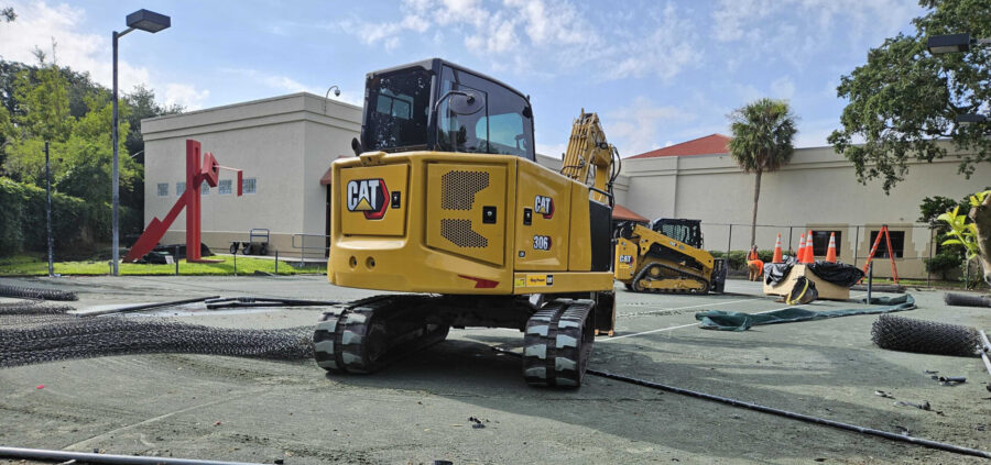 Picture of construction equipment on a JCA tennis court