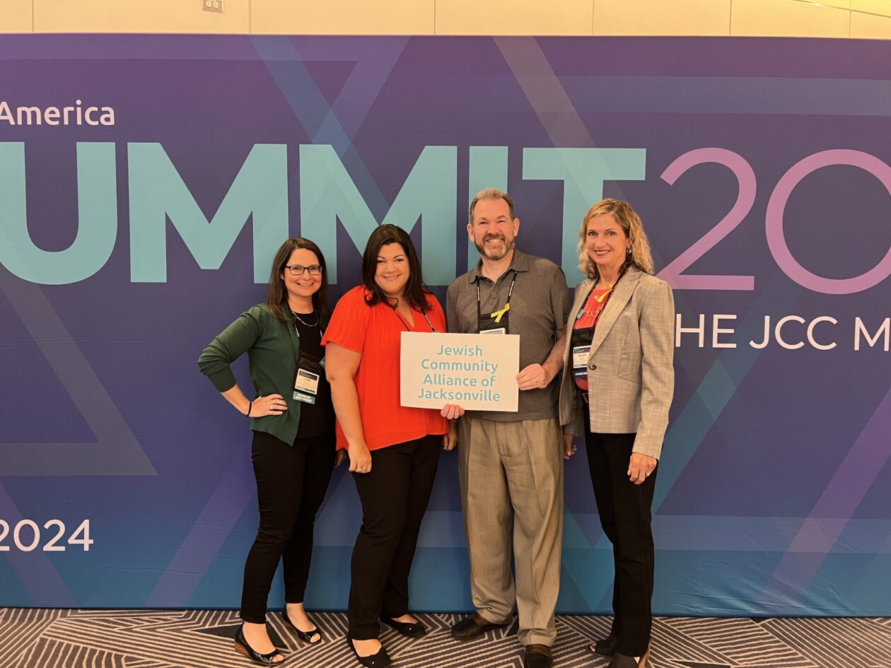 Lior Spring, Nicole Brown, Adam Chaskin and Helen Rowan stand together smiling at the JCCA Biennial Summit 2024 Conference.