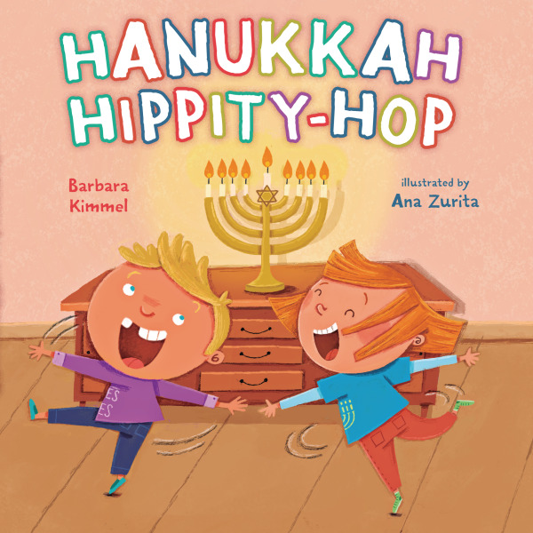 Two cheerful children dance near a lit menorah. Title: "Hanukkah Hippity-Hop" by Barbara Kimmel, illustrated by Ana Zurita.