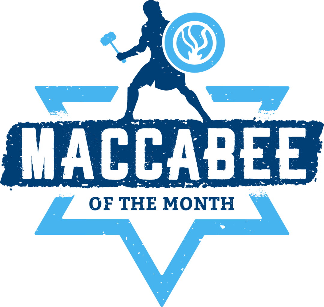 Silhouette of a warrior with a hammer and shield above text reading "Maccabee of the Month" on a blue Star of David background.