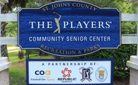 Sign for St. Johns County The Players Community Senior Center, showcasing partnerships with CoA, Republic Services, PGA Tour, and St. Johns County Recreation & Parks.