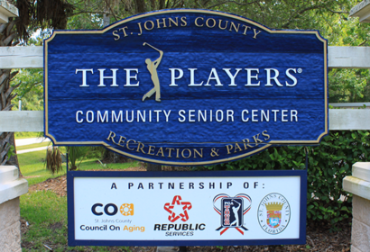 Sign for St. Johns County The Players Community Senior Center, showcasing partnerships with CoA, Republic Services, PGA Tour, and St. Johns County Recreation & Parks.