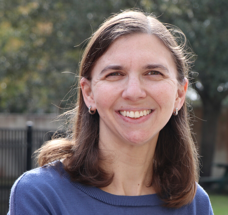 A woman wearing a blue shirt.