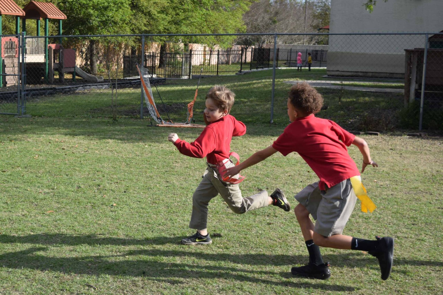 Boys playing flag football at the JCA as part of their program for children after school.