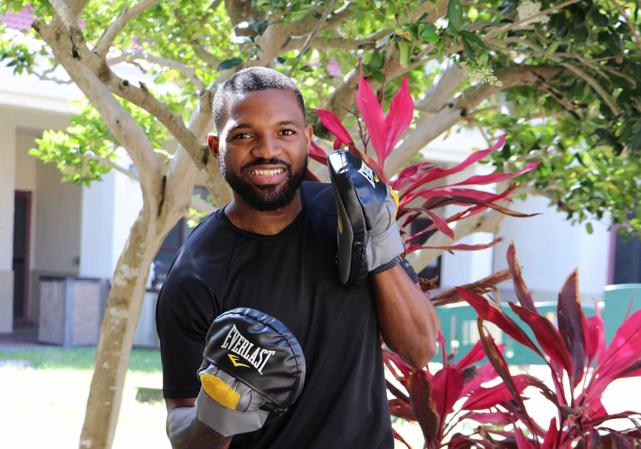 Man smiling boxing.