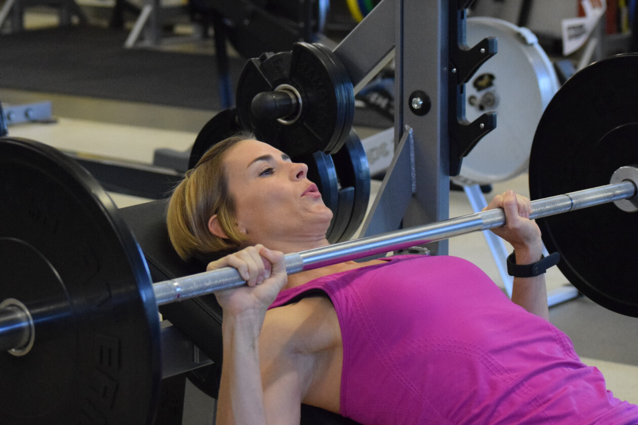 Woman lifting weights.