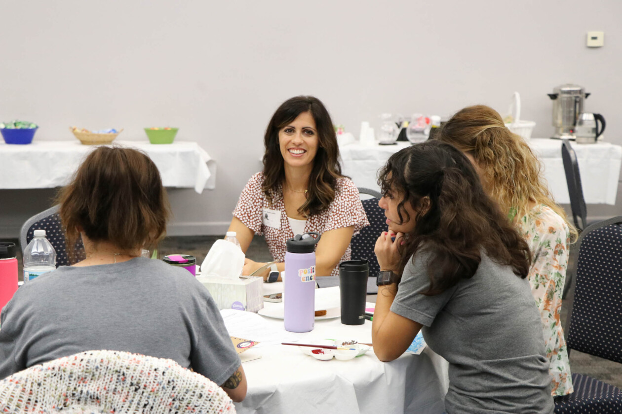 Educators sitting at a table together.