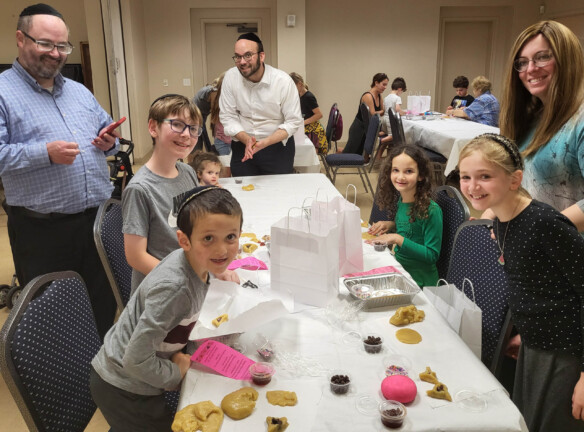 Families celebrating a Jewish holiday.