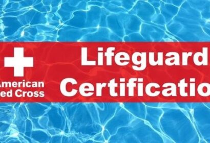 The image shows a red banner with a white cross and text that reads "American Red Cross Lifeguard Certification" overlaid on a background of clear blue swimming pool water.