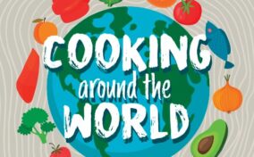 Illustration of a globe with the text "Cooking around the World" surrounded by vegetables, fruits, and a fish on a patterned background.