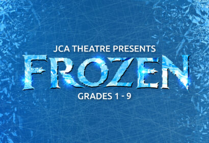 Blue background with ice patterns. Text reads: "JCA Theatre Presents Frozen Grades 1-9." The word "Frozen" appears in large, icy letters.