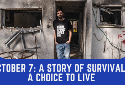 A man stands in the doorway of a damaged building wearing a shirt that says “Your spirit lives on.” Text below reads: “October 7: A Story of Survival - A Choice to Live.”.