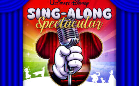 Promotional graphic for Ultimate Disney Sing-Along Spectacular featuring a gloved hand holding a microphone against a Mickey Mouse silhouette.